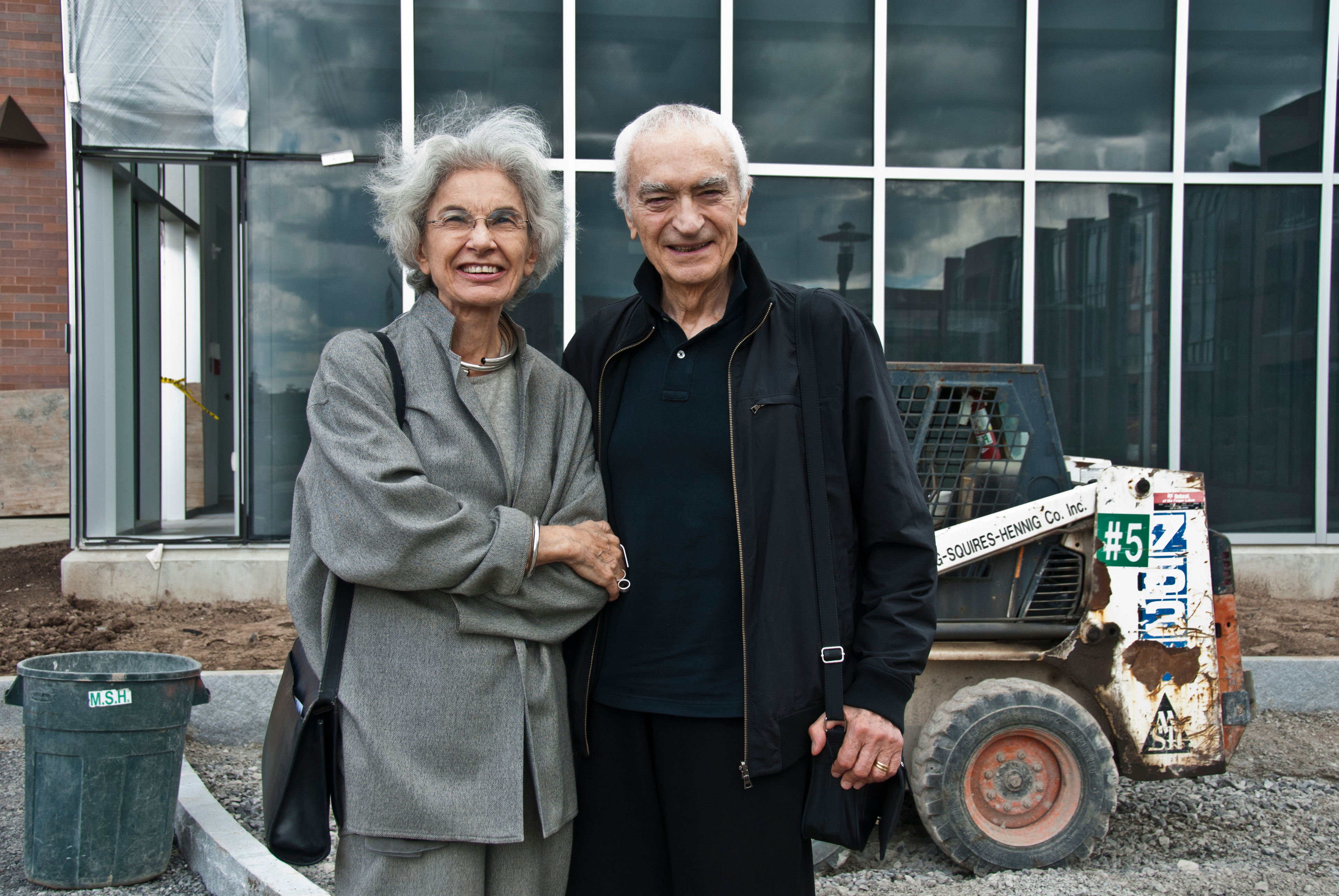 Lella and Massimo standing in front of the Vignelli Center for Design Studies during construction. 2010