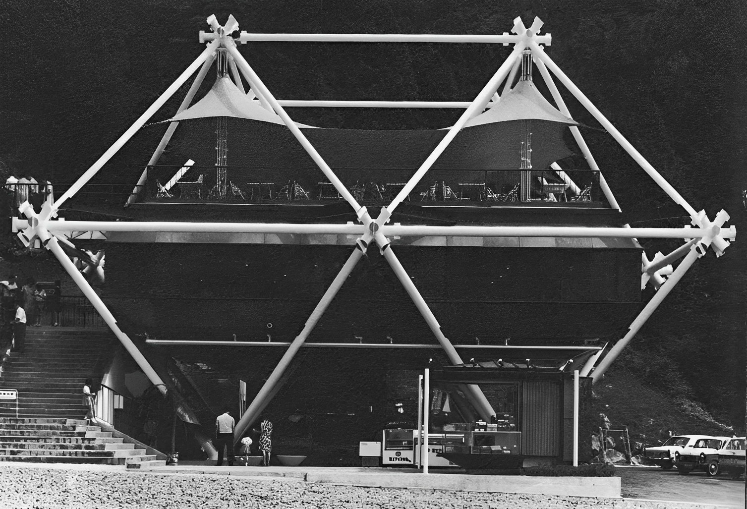 (10) The Odakyu Drive-In Restaurant, Otome Toge, 1969, was the first Metabolist building that really looked changeable: a giant, white space frame holds a red tent and brown capsule dining room. The exaggerated joints not only startle the passing motorist (roadside architecture) but are designed to be easily added to or dismantled. The joint swallows the building and the building swallows the joint (it is a restaurant). Actually, the antagonistic coexistence is the relation between the harmonious space and the inharmonious joint, which is placed dead centre in the restaurant.