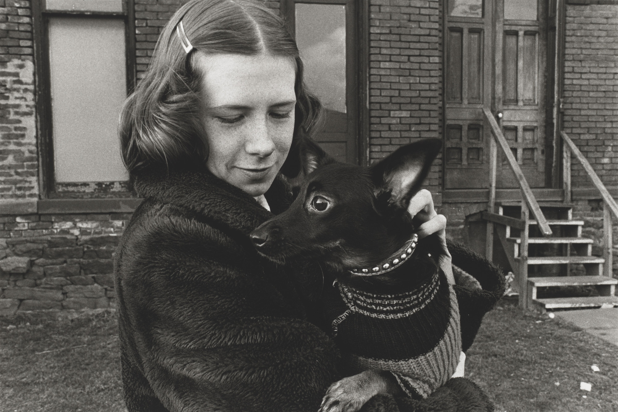 Mark Cohen. Girl Holding Small Black Dog. 1974. Source: MoMA